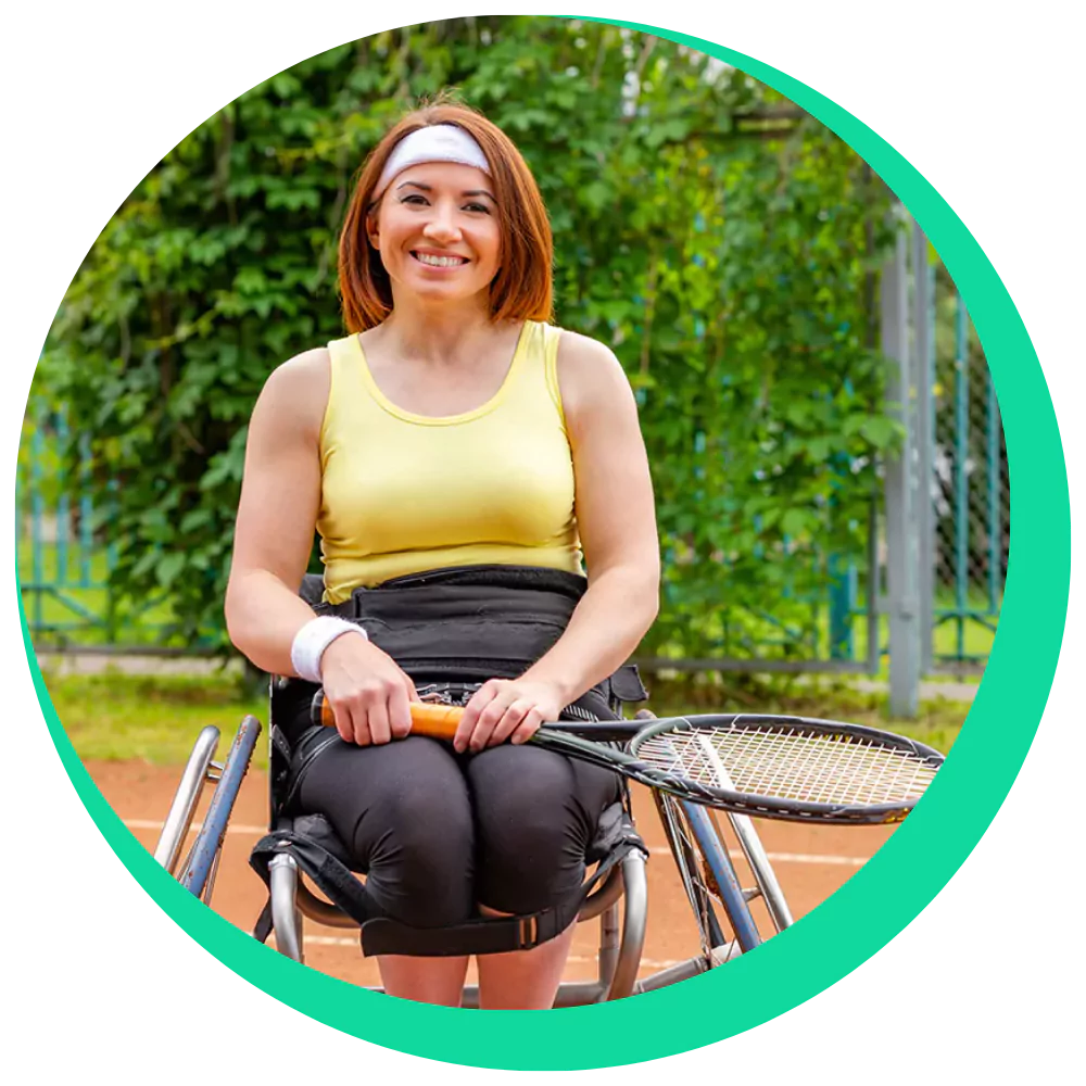 Disabled woman in wheelchair with tennis racket